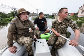 Ukrainian volunteers rescue stranded animals in flooded Kherson area. Picture Credits: Mykola Tymchenko/EPA