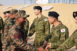 Troops of the Indian Army and Japanese Army exchange greetings during the opening ceremony of Joint Military Exercise ‘Dharma Guardian’ (Credits: ANI)