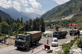 Indian Army trucks move along a highway to Ladakh on June 17. (Credits: Danish Ismail/Reuters)