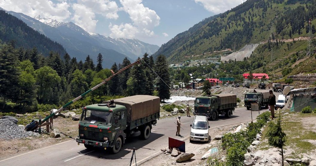 Indian Army trucks move along a highway to Ladakh on June 17. (Credits: Danish Ismail/Reuters)