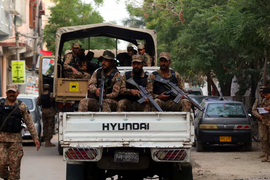 Soldiers patrol near a polling station on election day in Pakistan. Photograph: Rehan Khan/EPA